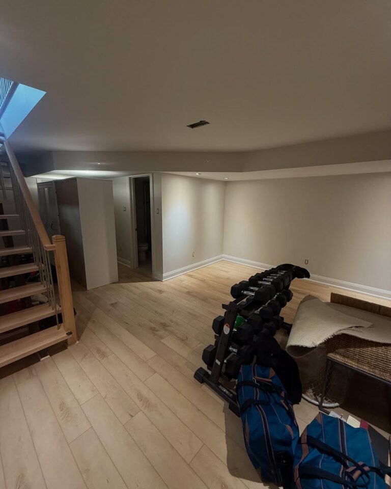 Detailed interior painting for a finished basement in Ottawa, using high-quality light-reflecting paint.
